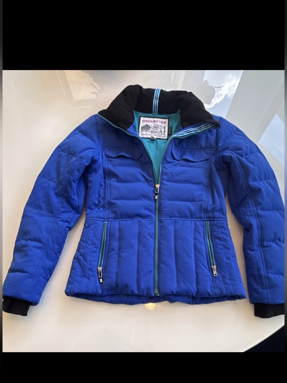 Obermeyer women’s Royal Blue Quilted Puffer Jacket with Black Collar